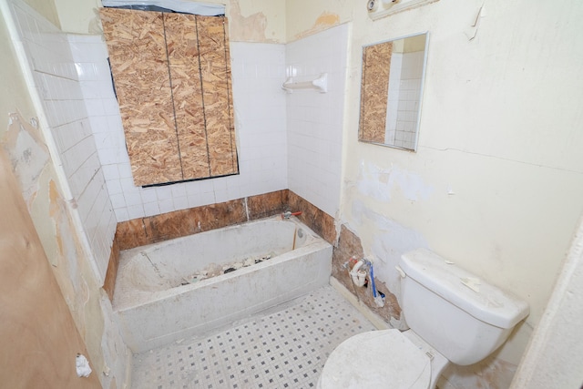 bathroom featuring toilet and a bathing tub