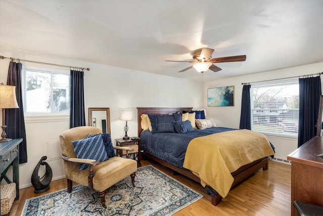 bedroom featuring ceiling fan and light hardwood / wood-style floors