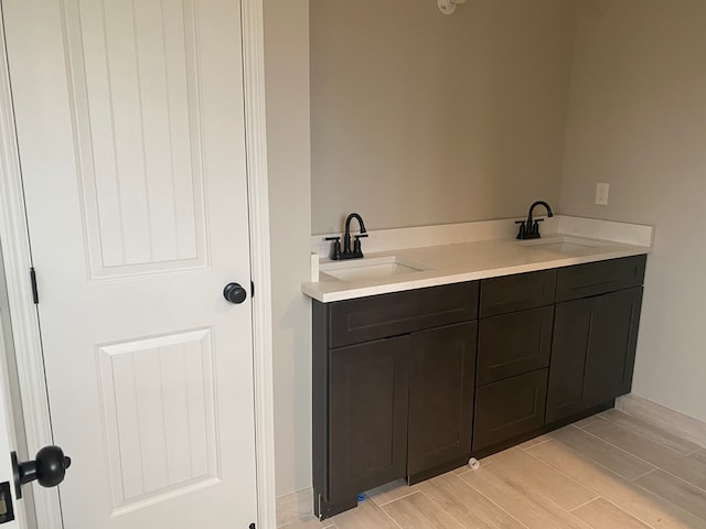 bathroom featuring hardwood / wood-style flooring and vanity