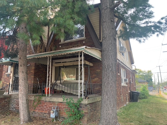 view of side of property with a porch