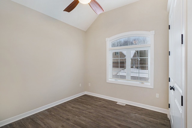 empty room featuring ceiling fan, dark hardwood / wood-style flooring, and lofted ceiling