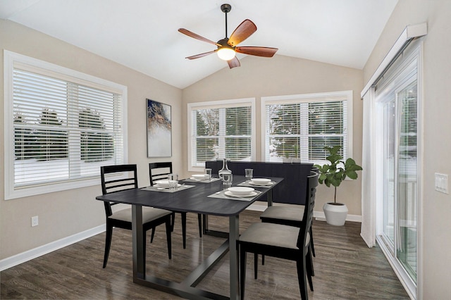 dining room featuring ceiling fan, a healthy amount of sunlight, lofted ceiling, and dark hardwood / wood-style floors