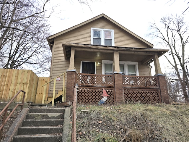 rear view of property with a porch