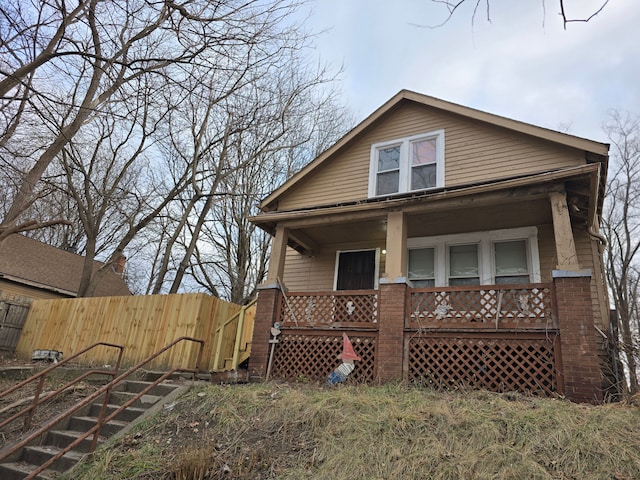 back of house with covered porch