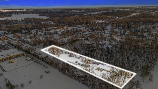 aerial view at dusk with a water view