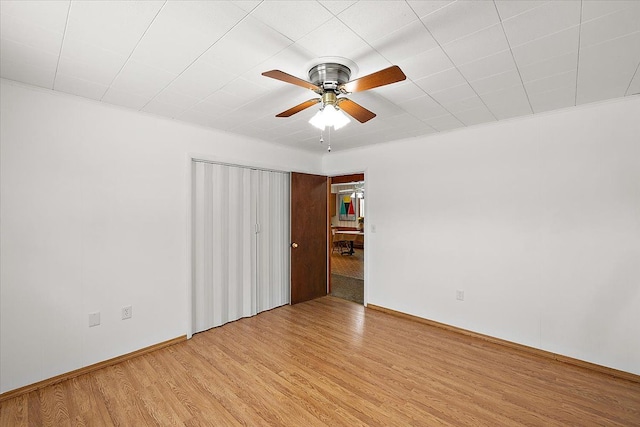 unfurnished room featuring ceiling fan and light hardwood / wood-style flooring