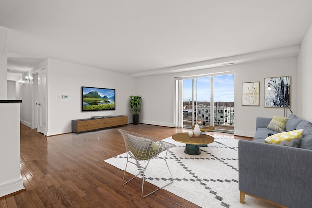 living room with dark hardwood / wood-style floors