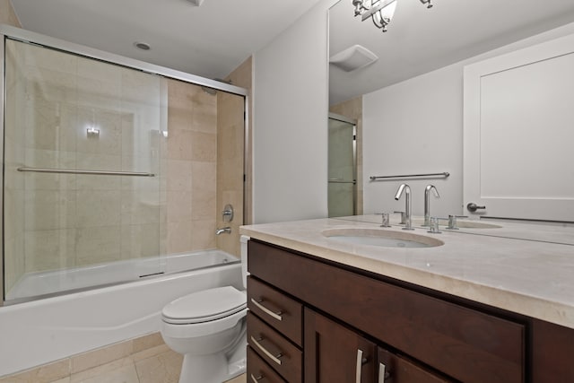 full bathroom with enclosed tub / shower combo, tile patterned flooring, vanity, and toilet