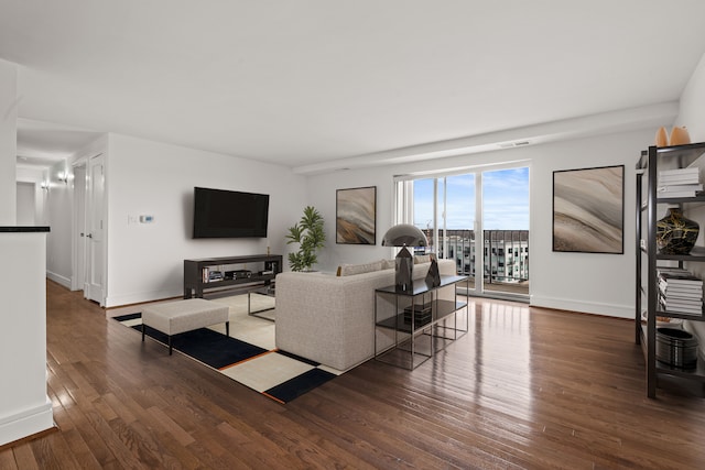 living room featuring dark wood-type flooring