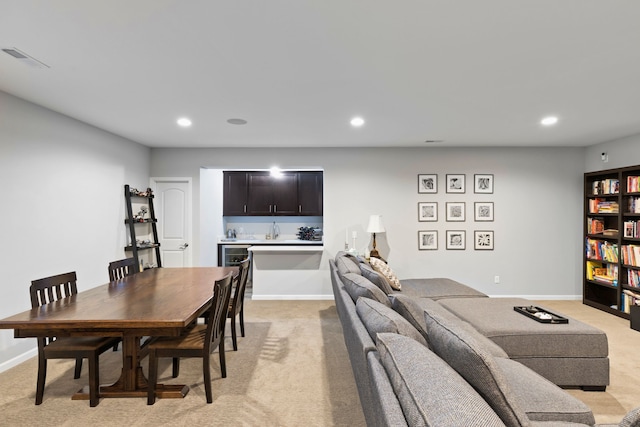 dining room with light carpet