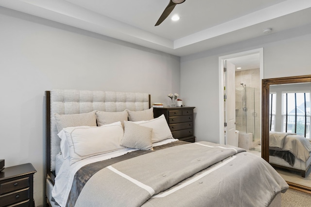 bedroom with ensuite bath and ceiling fan