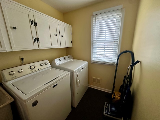 laundry area with cabinets and independent washer and dryer