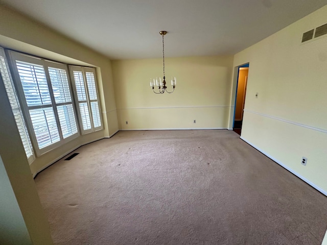 unfurnished dining area featuring carpet and an inviting chandelier