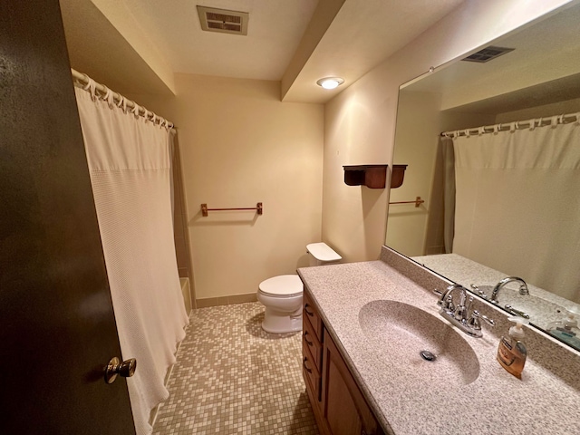 full bathroom featuring tile patterned floors, vanity, toilet, and shower / bath combo with shower curtain