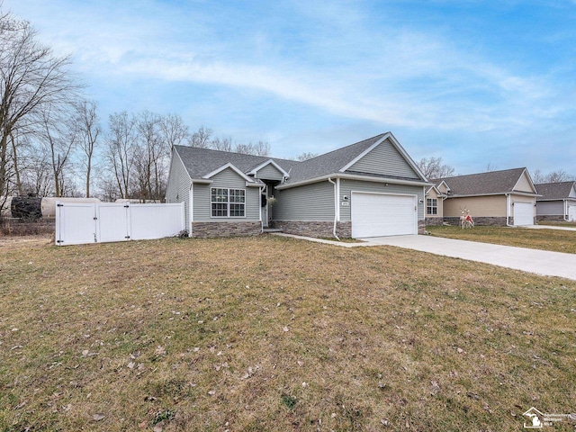 view of front of house with a garage and a front lawn