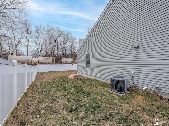 view of yard with central AC unit