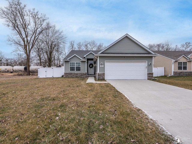 single story home featuring a front yard and a garage