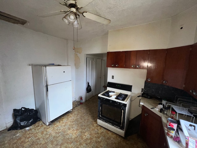 kitchen with dark brown cabinetry, ceiling fan, and white appliances