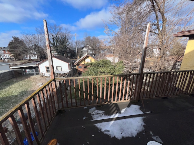 wooden deck with a residential view