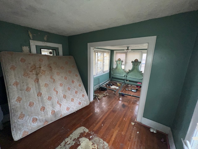 bedroom featuring dark hardwood / wood-style flooring