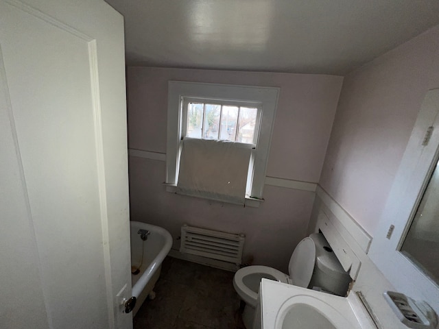 full bathroom featuring a bathtub and toilet