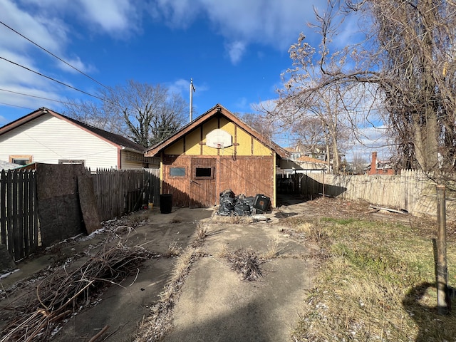 back of property with fence