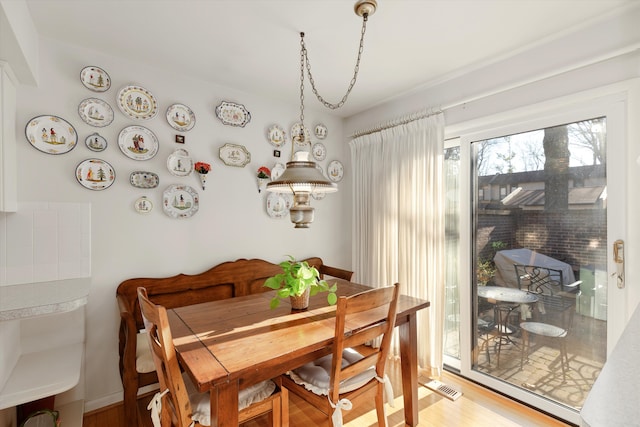 dining area featuring wood-type flooring