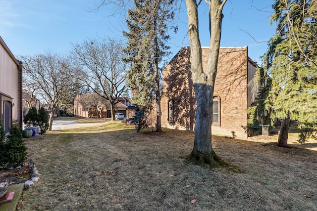 view of property exterior with a lawn