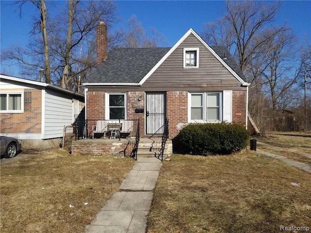 bungalow-style house featuring a front yard