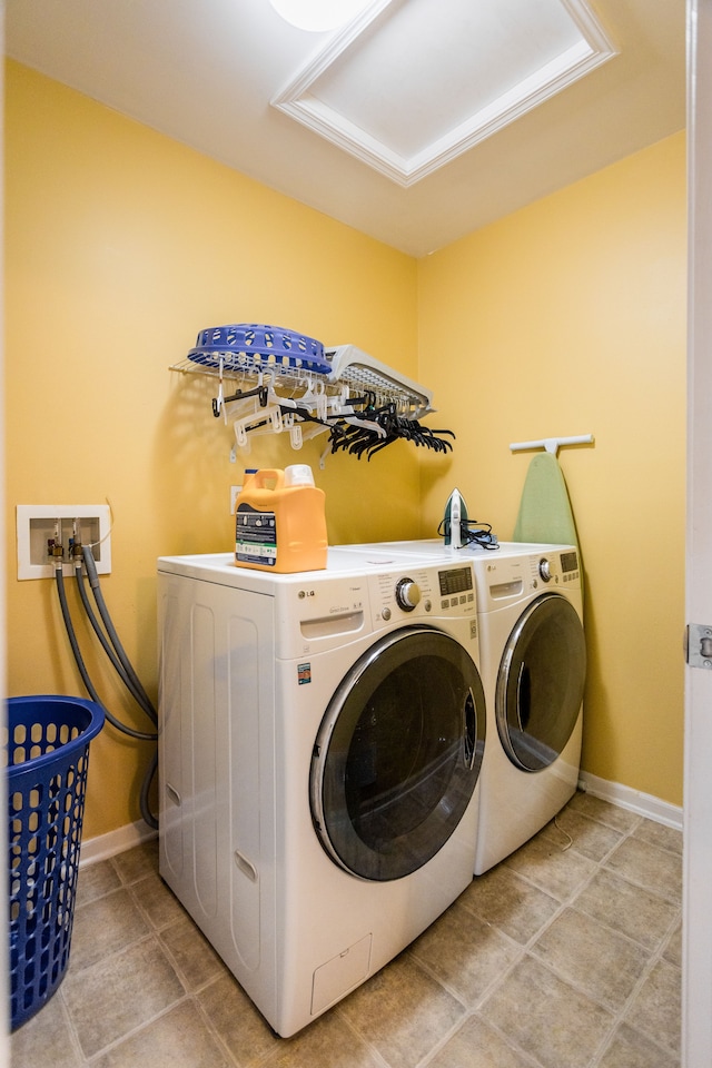 washroom with washing machine and clothes dryer