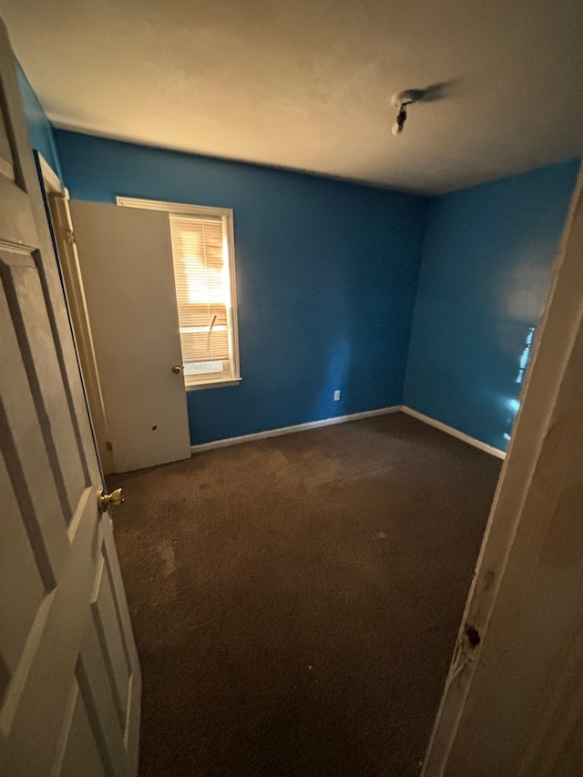 unfurnished bedroom featuring carpet flooring