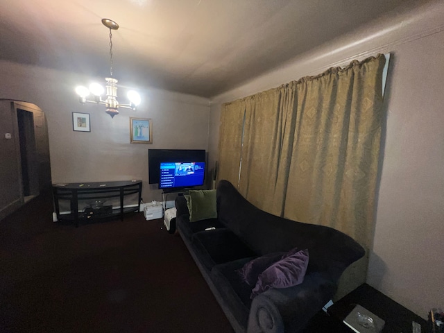 living room featuring a notable chandelier