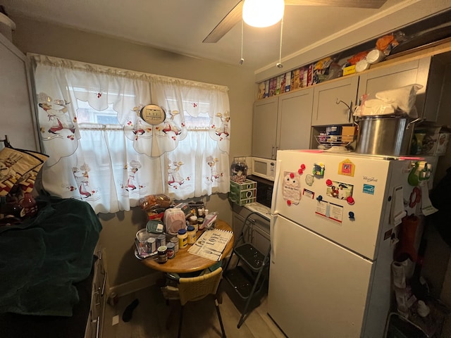 kitchen featuring white refrigerator and ceiling fan