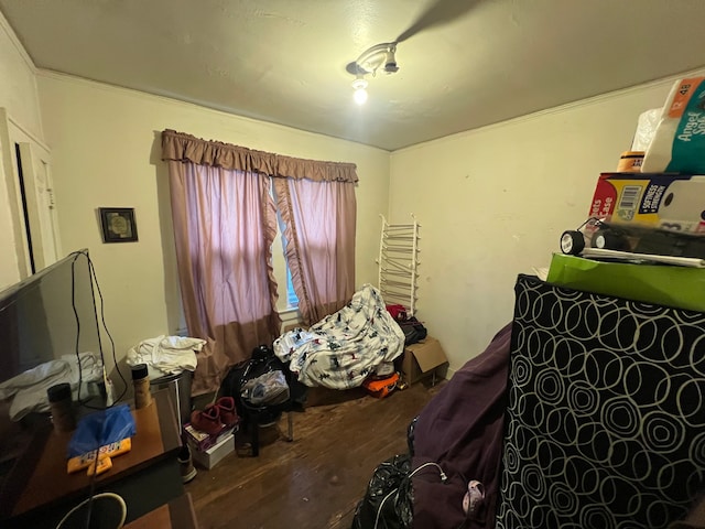 bedroom with hardwood / wood-style floors