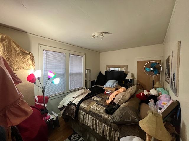 bedroom with hardwood / wood-style flooring