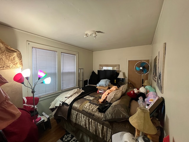 bedroom with hardwood / wood-style flooring