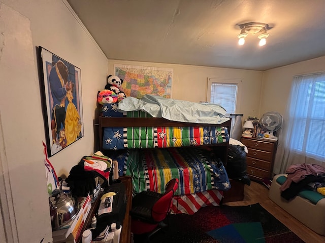 bedroom with hardwood / wood-style floors