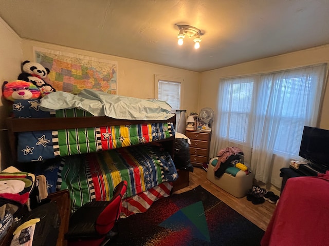 bedroom with hardwood / wood-style flooring