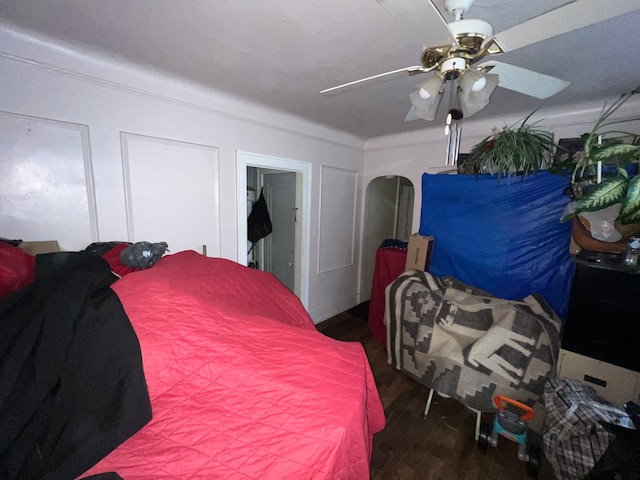 bedroom featuring ceiling fan and dark wood-type flooring