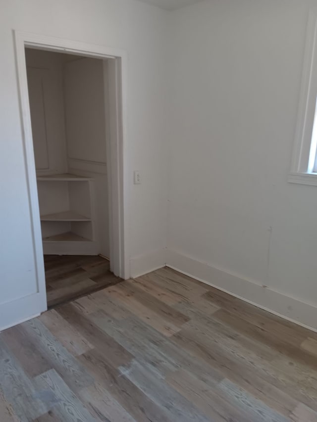 interior space with a closet and light hardwood / wood-style flooring