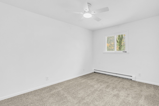 carpeted empty room with ceiling fan and a baseboard heating unit