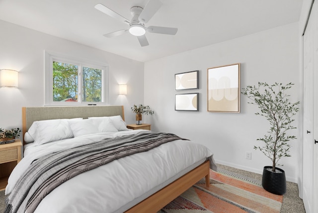 bedroom with carpet flooring, a closet, and ceiling fan