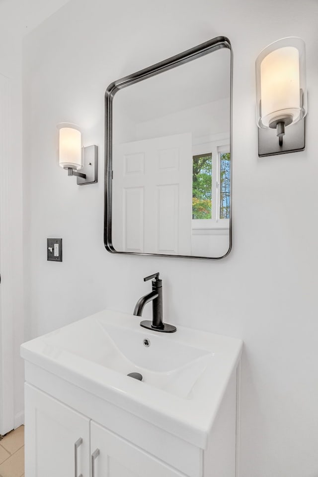 bathroom with tile patterned flooring and vanity