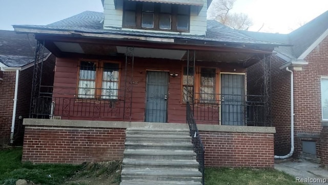 doorway to property featuring a porch