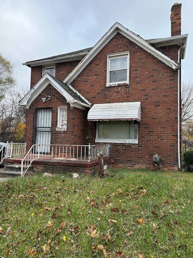 back of house with a yard