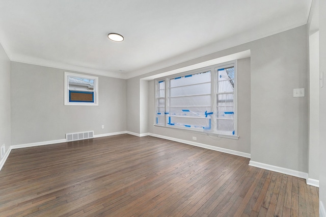 empty room featuring dark wood-type flooring