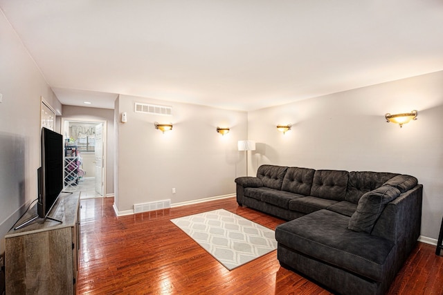 living room featuring dark wood-type flooring