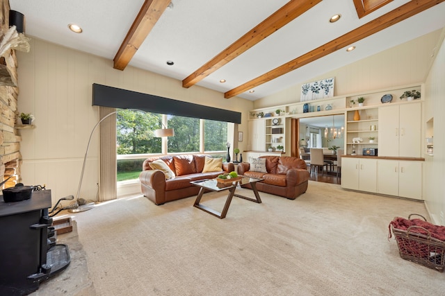 carpeted living room featuring vaulted ceiling with beams and a wood stove