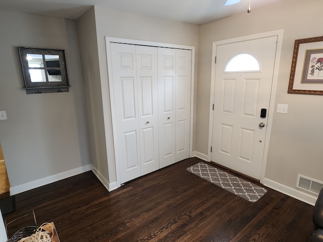 entrance foyer with dark hardwood / wood-style flooring