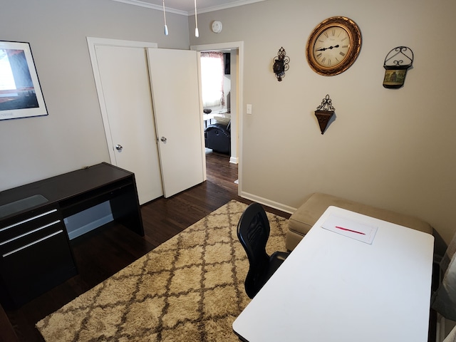 home office featuring dark hardwood / wood-style flooring and crown molding